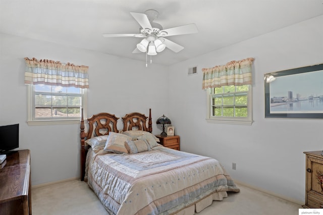 2106 S 145th Ave, Omaha, NE 68144 - carpeted bedroom with multiple windows, baseboards, and ceiling fan