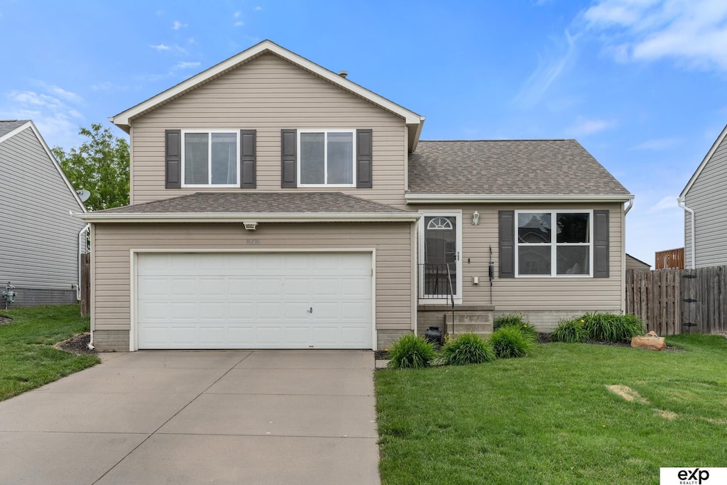 16136 Cherrywood St, Omaha, NE 68136 - view of front of home with a garage, driveway, and roof with shingles