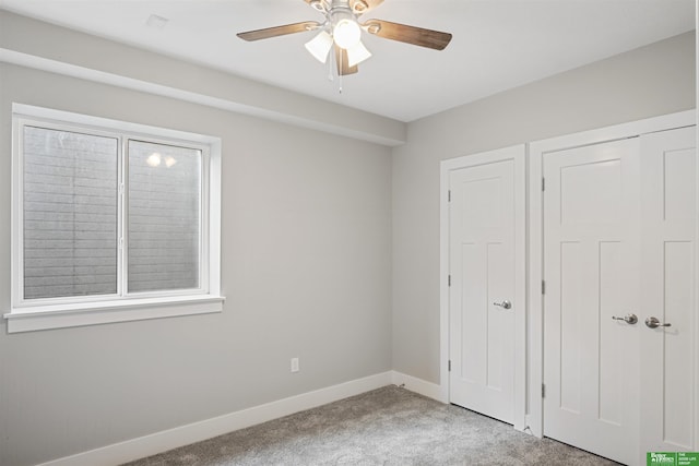 2273 N 38th Ave, Omaha, NE 68111 - unfurnished bedroom with carpet flooring, baseboards, a closet, and a ceiling fan