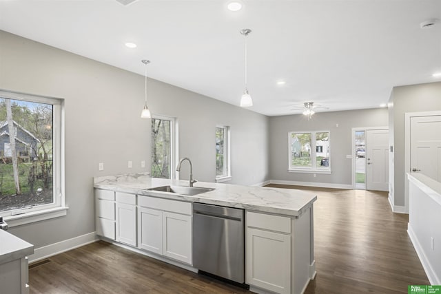 2273 N 38th Ave, Omaha, NE 68111 - kitchen featuring dishwasher, a sink, a peninsula, dark wood-style floors, and baseboards
