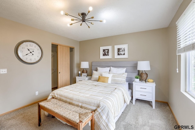 15614 Redwood St, Omaha, NE 68136 - bedroom with light carpet, a chandelier, baseboards, and multiple windows