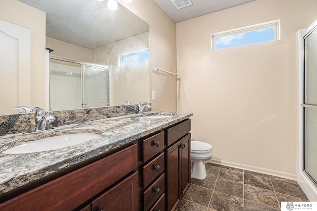 7423 N 139th Ave, Omaha, NE 68142 - full bath featuring baseboards, a stall shower, double vanity, and toilet