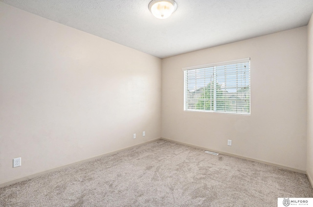 7423 N 139th Ave, Omaha, NE 68142 - unfurnished room featuring carpet floors and baseboards