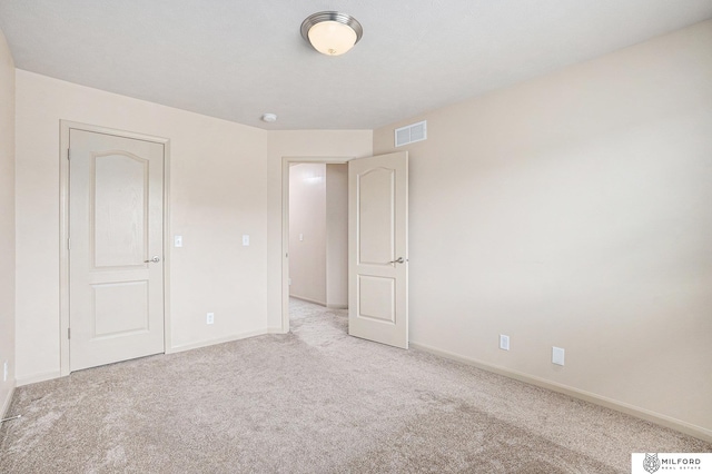 7423 N 139th Ave, Omaha, NE 68142 - unfurnished bedroom featuring light colored carpet and baseboards
