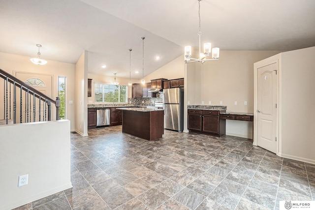 7423 N 139th Ave, Omaha, NE 68142 - kitchen with stainless steel appliances, a chandelier, dark brown cabinetry, under cabinet range hood, and backsplash