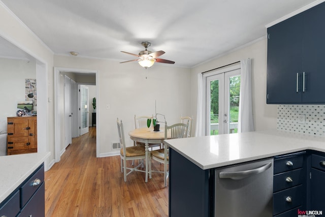 3920 Randolph St, Lincoln, NE 68510 - kitchen with dishwasher, blue cabinetry, light countertops, and ornamental molding