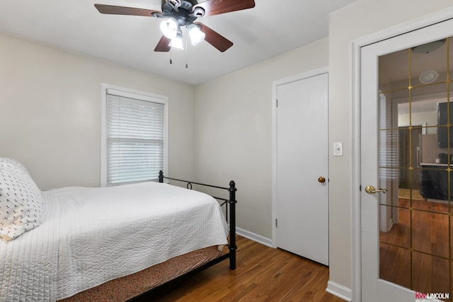 3920 Randolph St, Lincoln, NE 68510 - bedroom with wood finished floors, baseboards, and a ceiling fan
