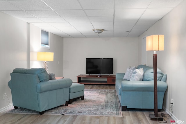 3920 Randolph St, Lincoln, NE 68510 - living room with wood finished floors, a drop ceiling, and baseboards