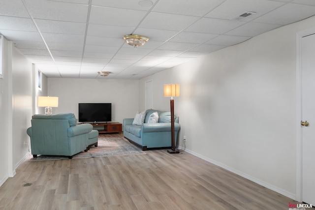 3920 Randolph St, Lincoln, NE 68510 - living room featuring light wood-style floors, baseboards, and a drop ceiling
