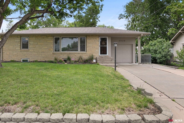 3920 Randolph St, Lincoln, NE 68510 - single story home with a garage, concrete driveway, a front yard, a shingled roof, and stone siding