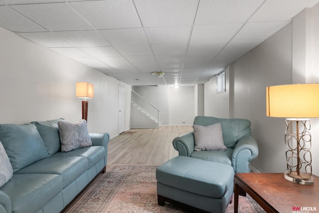 3920 Randolph St, Lincoln, NE 68510 - living room with wood finished floors, stairs, and a drop ceiling