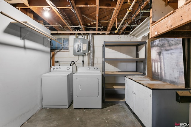3920 Randolph St, Lincoln, NE 68510 - laundry area featuring washer and dryer, cabinet space, and electric panel