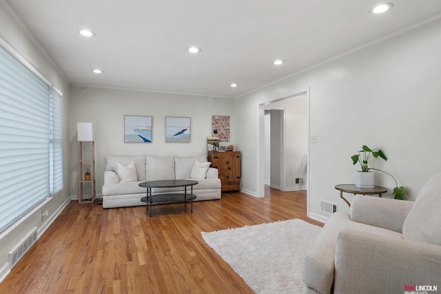 3920 Randolph St, Lincoln, NE 68510 - living room featuring ornamental molding, light wood finished floors, recessed lighting, baseboards, and plenty of natural light