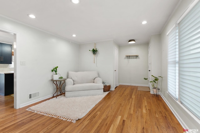 3920 Randolph St, Lincoln, NE 68510 - living area featuring light wood-style floors, recessed lighting, baseboards, and ornamental molding