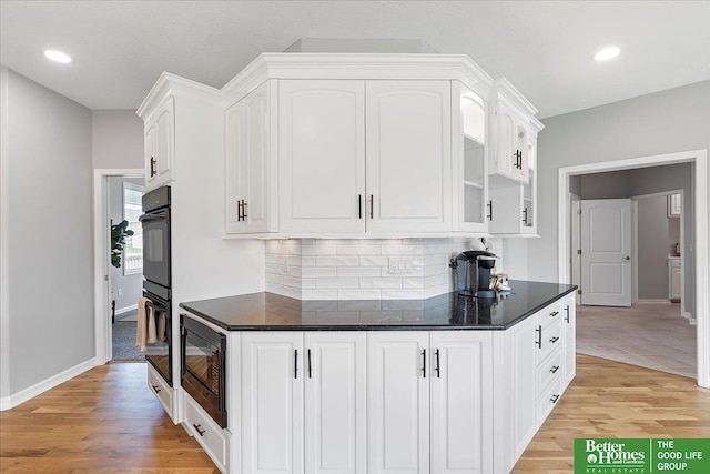 16831 Chandler St, Omaha, NE 68136 - kitchen featuring black appliances, light wood finished floors, white cabinetry, tasteful backsplash, and baseboards