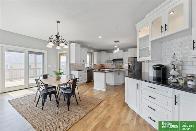 16831 Chandler St, Omaha, NE 68136 - dining room featuring light wood-style floors, a chandelier, and recessed lighting