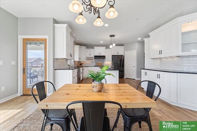 16831 Chandler St, Omaha, NE 68136 - dining area featuring recessed lighting, light wood-type flooring, baseboards, and a chandelier