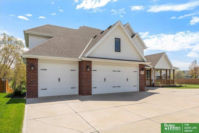 16831 Chandler St, Omaha, NE 68136 - traditional-style house featuring brick siding, concrete driveway, a shingled roof, and an attached garage