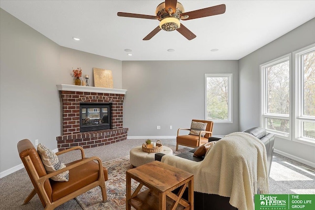 16831 Chandler St, Omaha, NE 68136 - carpeted living room with baseboards, plenty of natural light, a ceiling fan, a fireplace, and recessed lighting