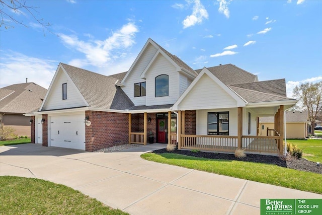 16831 Chandler St, Omaha, NE 68136 - view of front facade featuring covered porch, brick siding, concrete driveway, and a garage