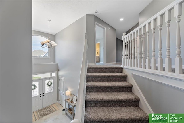 16831 Chandler St, Omaha, NE 68136 - stairs featuring a chandelier and recessed lighting
