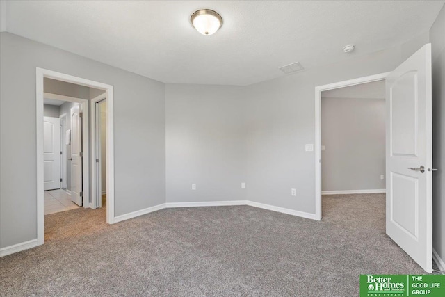 16831 Chandler St, Omaha, NE 68136 - empty room featuring carpet, baseboards, and a smoke detector