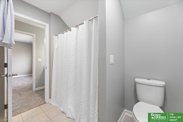 16831 Chandler St, Omaha, NE 68136 - bathroom with toilet, tile patterned floors, curtained shower, and baseboards