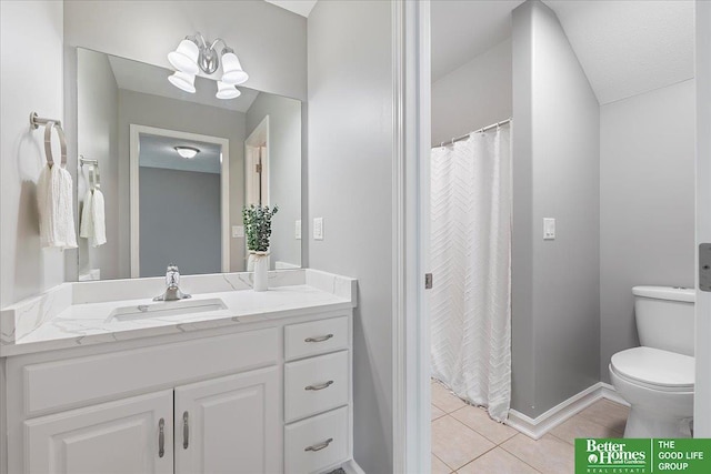 16831 Chandler St, Omaha, NE 68136 - bathroom with vanity, tile patterned floors, toilet, baseboards, and a chandelier