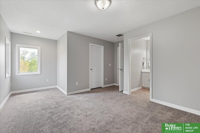 16831 Chandler St, Omaha, NE 68136 - unfurnished bedroom with carpet flooring, baseboards, and ensuite bath