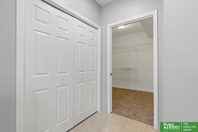 16831 Chandler St, Omaha, NE 68136 - hallway with light colored carpet and light tile patterned floors