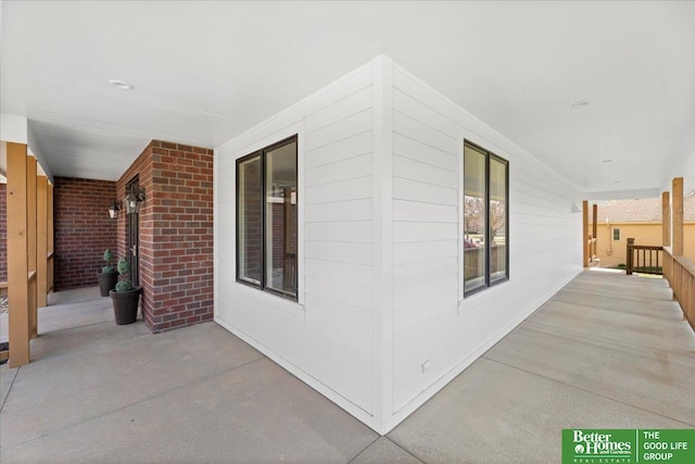 16831 Chandler St, Omaha, NE 68136 - exterior space with covered porch and brick siding