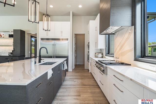 1520 S 218th St, Elkhorn, NE 68022 - kitchen featuring a sink, a large island, stainless steel appliances, white cabinets, and modern cabinets