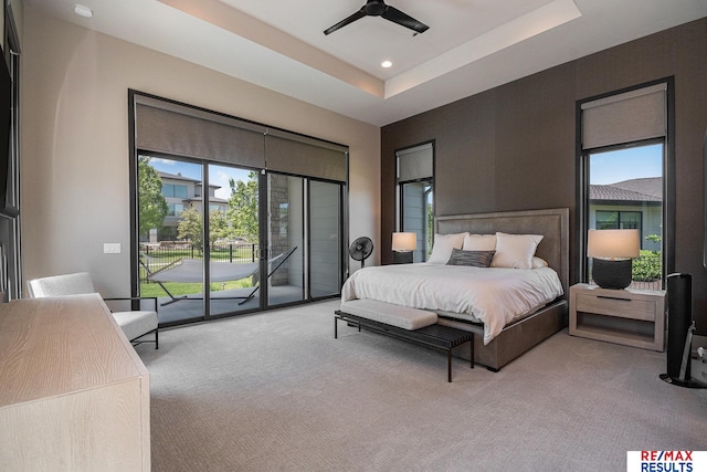 1520 S 218th St, Elkhorn, NE 68022 - carpeted bedroom featuring access to exterior, multiple windows, recessed lighting, a tray ceiling, and ceiling fan