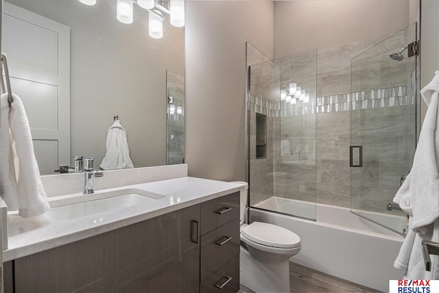 1520 S 218th St, Elkhorn, NE 68022 - full bath with wood finished floors, vanity, toilet, and enclosed tub / shower combo