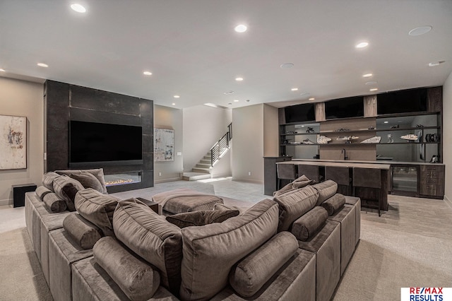 1520 S 218th St, Elkhorn, NE 68022 - living area with light carpet, recessed lighting, stairs, and baseboards