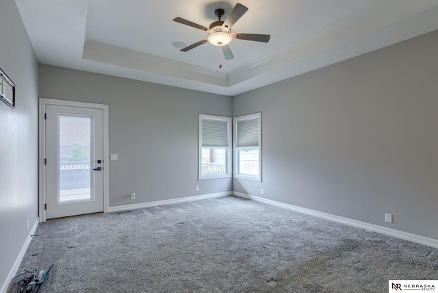 11051 Edgewater Dr, Papillion, NE 68046 - carpeted spare room with ceiling fan, baseboards, crown molding, and a raised ceiling
