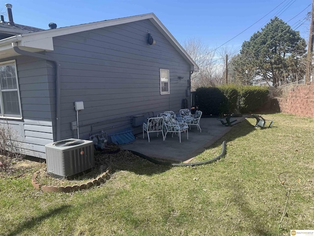 7624 Nebraska Ave, Omaha, NE 68134 - back of property with central AC, a patio, and a yard