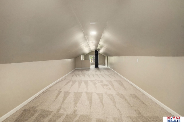 4709 Cuming St, Omaha, NE 68132 - additional living space featuring carpet floors, lofted ceiling, and baseboards