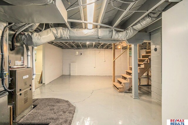 4709 Cuming St, Omaha, NE 68132 - unfinished below grade area featuring stairs and heating unit