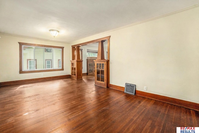 4709 Cuming St, Omaha, NE 68132 - unfurnished room with hardwood / wood-style floors, ornamental molding, decorative columns, and baseboards