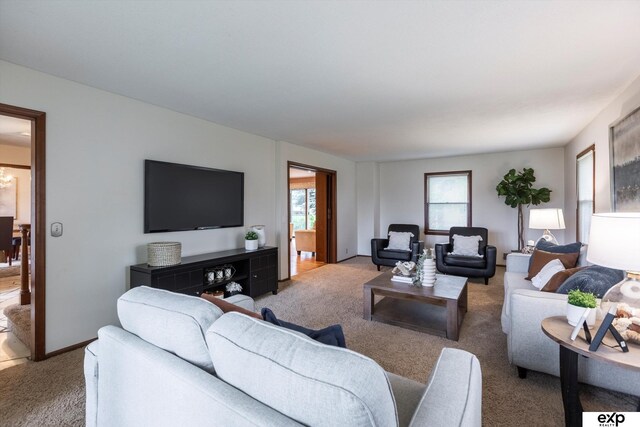 12212 Leavenworth Rd, Omaha, NE 68154 - carpeted living room featuring healthy amount of natural light