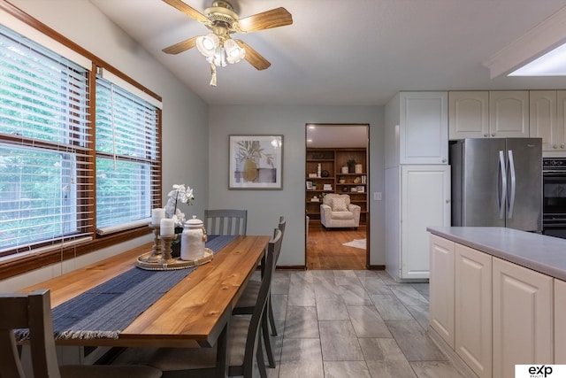12212 Leavenworth Rd, Omaha, NE 68154 - dining area featuring a ceiling fan and baseboards