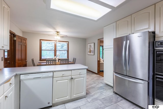 12212 Leavenworth Rd, Omaha, NE 68154 - kitchen with freestanding refrigerator, white dishwasher, a peninsula, a ceiling fan, and light countertops