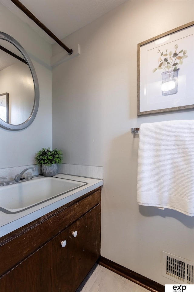 12212 Leavenworth Rd, Omaha, NE 68154 - bathroom with vanity and baseboards