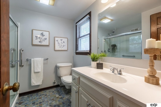 12212 Leavenworth Rd, Omaha, NE 68154 - full bathroom with toilet, vanity, a shower with shower door, and baseboards