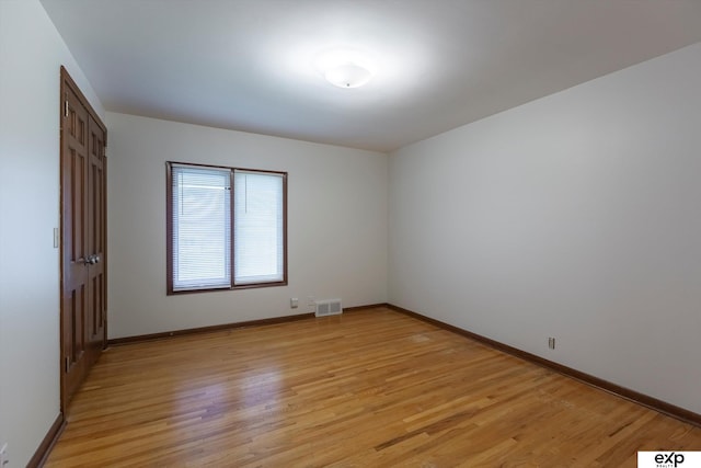 12212 Leavenworth Rd, Omaha, NE 68154 - unfurnished room with light wood-type flooring and baseboards