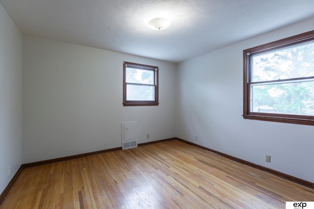 12212 Leavenworth Rd, Omaha, NE 68154 - unfurnished room featuring light wood finished floors and baseboards