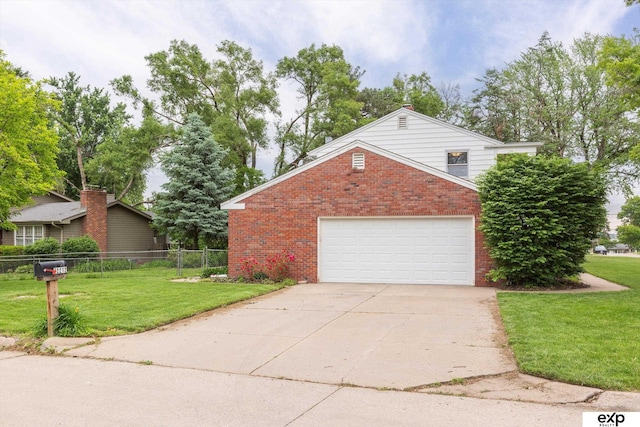 12212 Leavenworth Rd, Omaha, NE 68154 - view of side of home with brick siding, driveway, and a garage