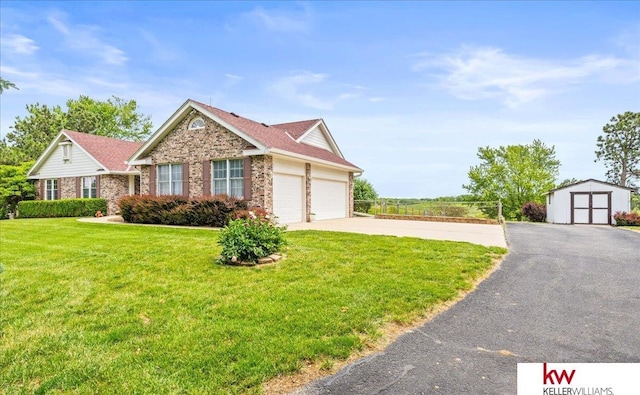 17911 Peterson Rd, Plattsmouth, NE 68048 - view of front of property featuring brick siding, a front yard, driveway, and an attached garage