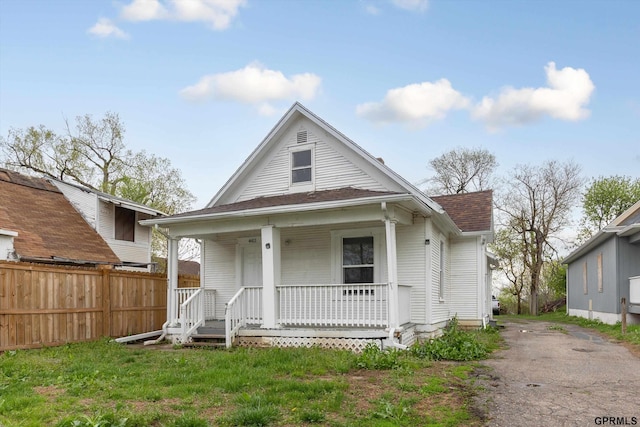 4411 Commercial Ave, Omaha, NE 68110 - view of front of home featuring covered porch, roof with shingles, and driveway